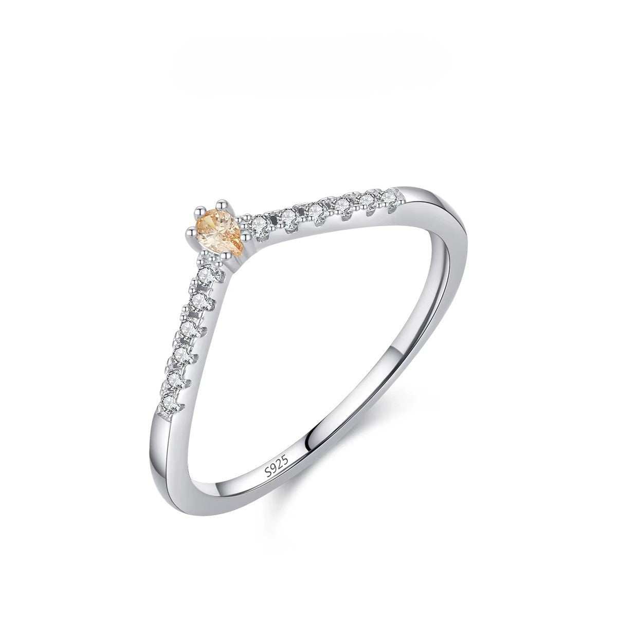 Silver ring with small zircons on a white background