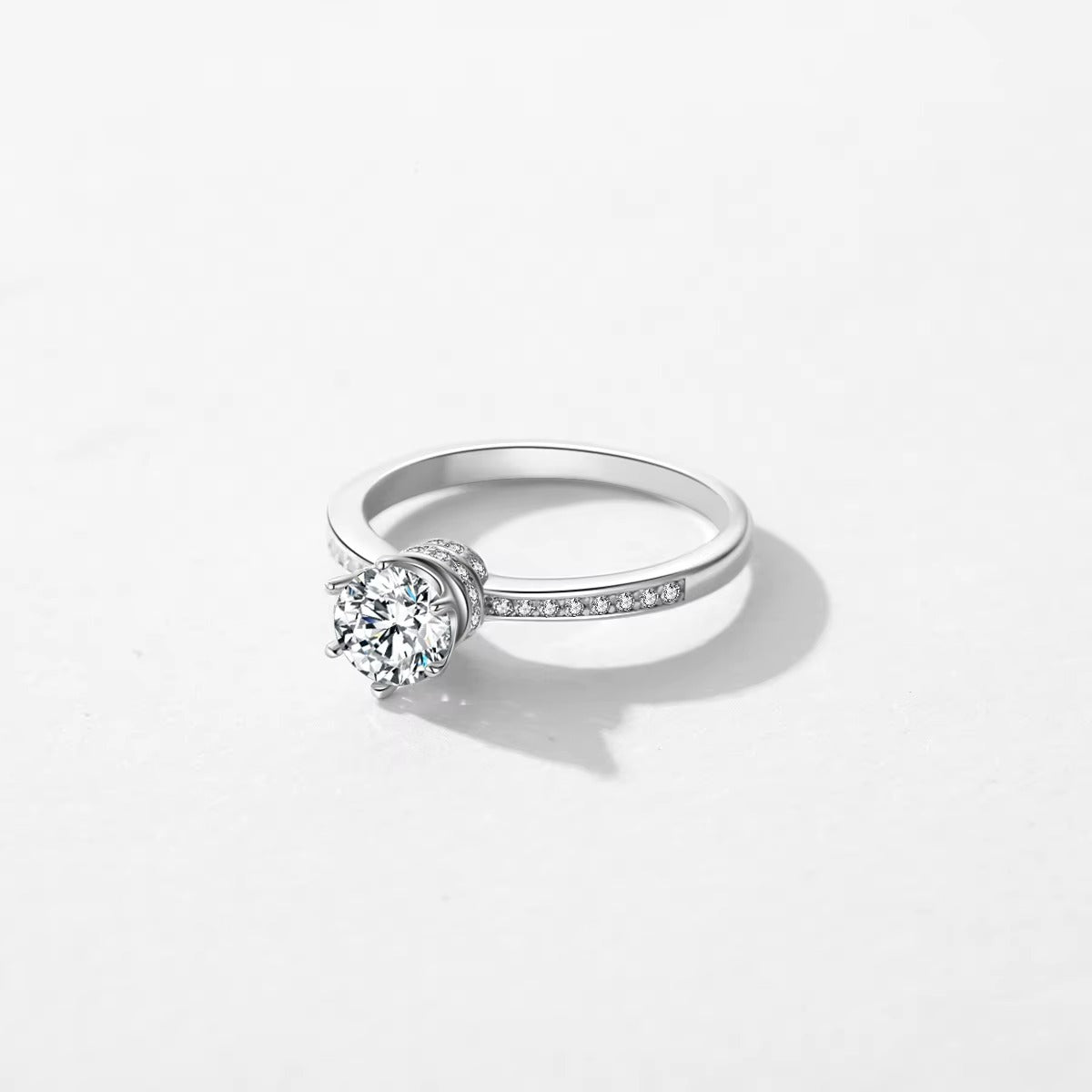 Zircon ring on a light gray background