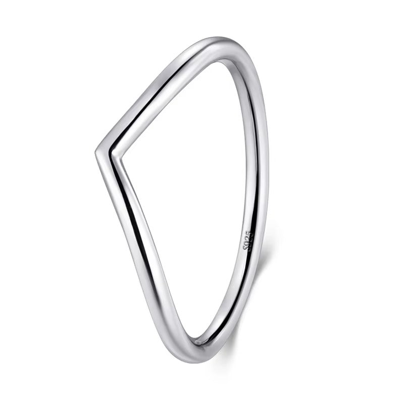 Silver ring with a geometric design on a white background