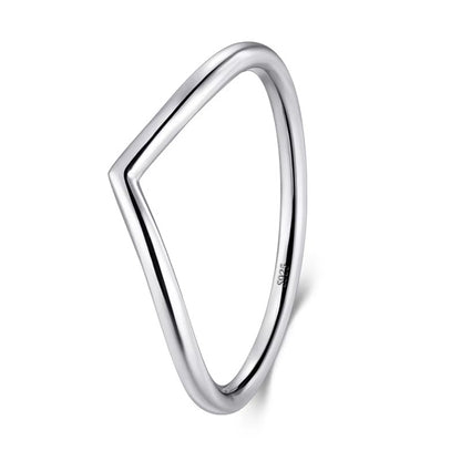 Silver ring with a geometric design on a white background