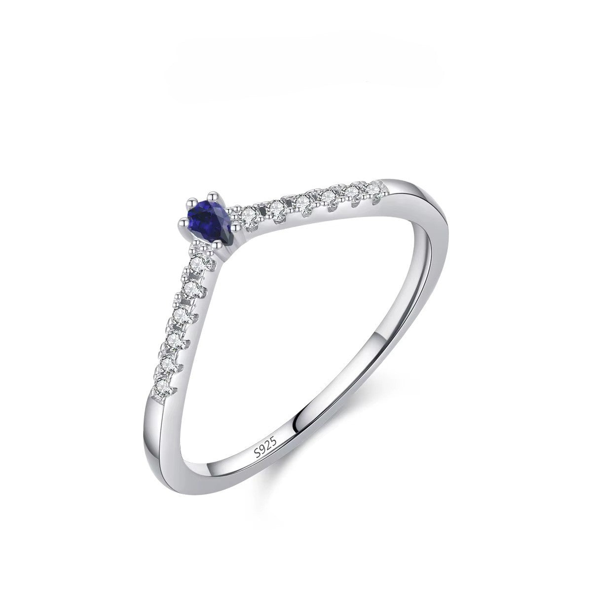 Silver ring with a blue gemstone and small zircons on a white background