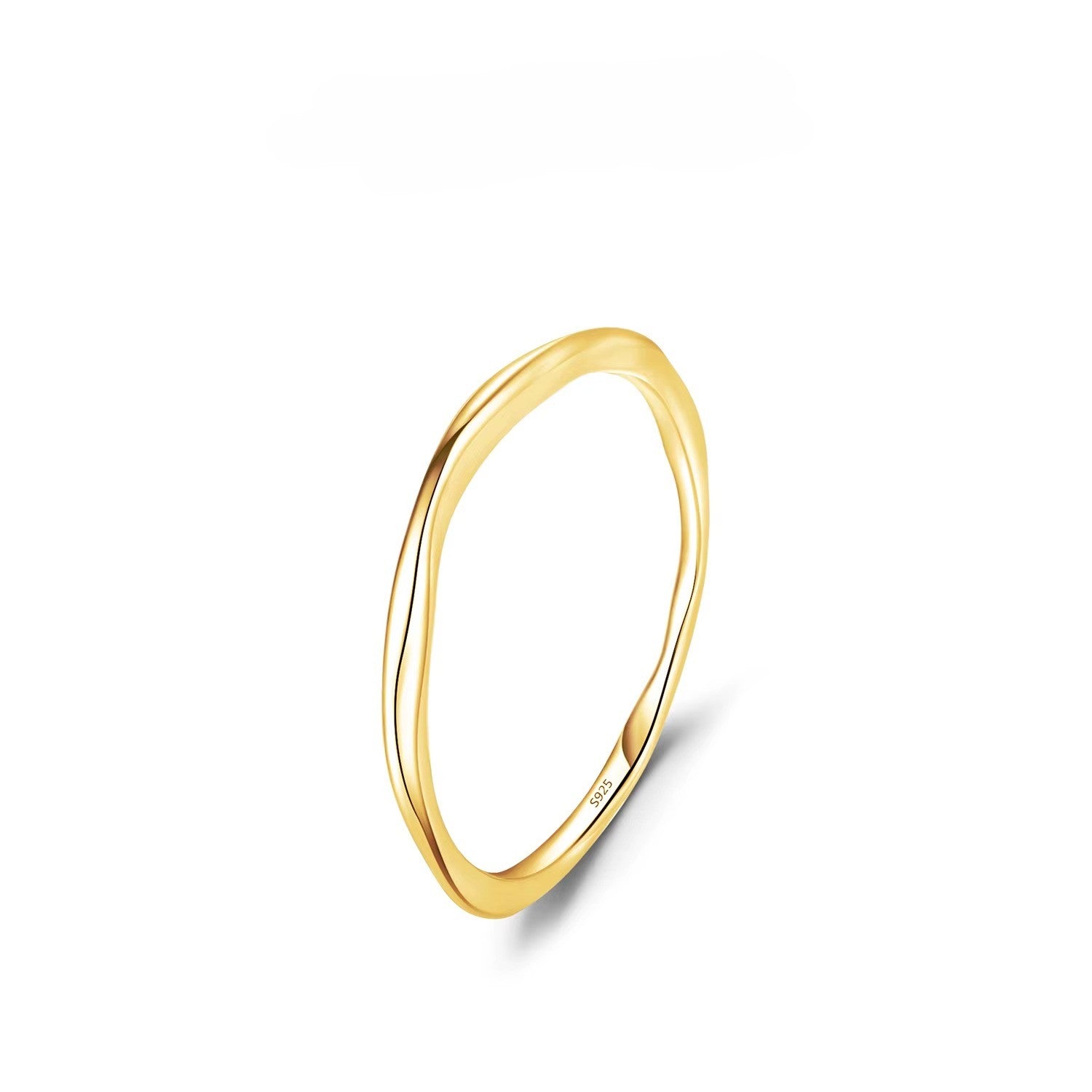 Gold ring on a white background