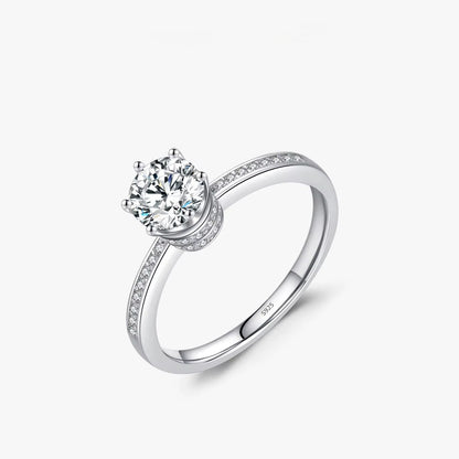 Silver ring with a zircon on a white background