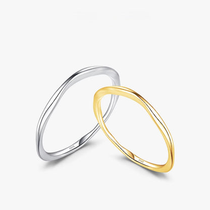 Silver and gold rings on a white background