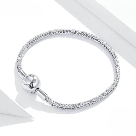 925 sterling silver snake-chain bracelet with polished sphere clasp on white background