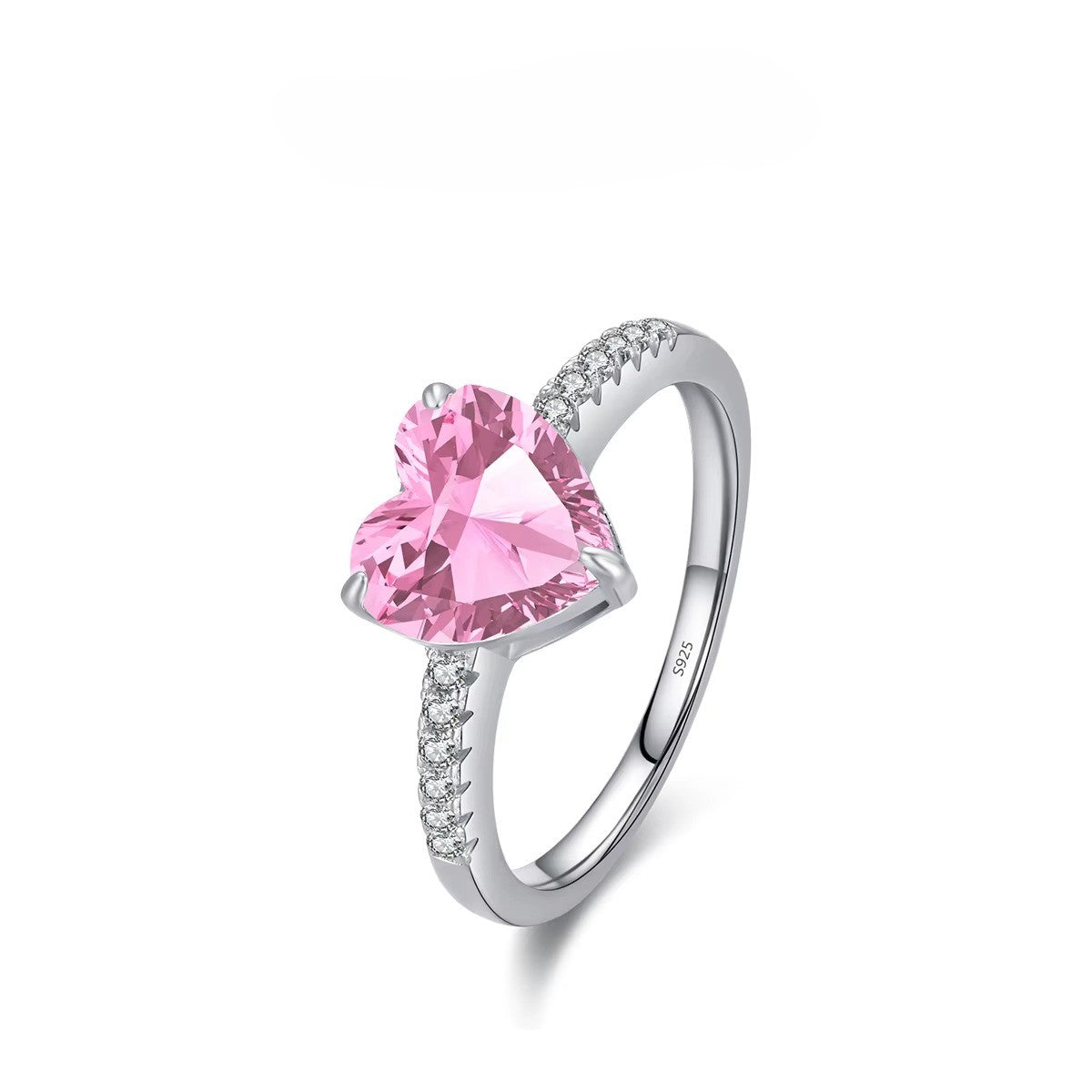 Silver ring with a pink heart-shaped gemstone on a white background